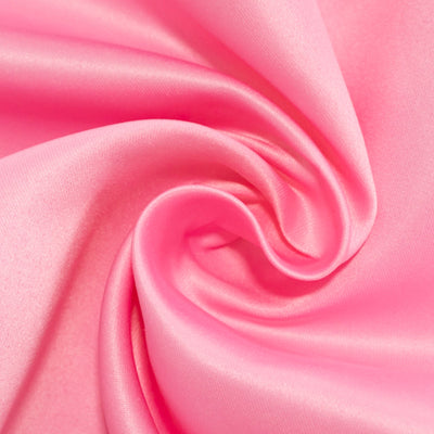 Soft pink satin fabric with smooth texture and elegant drape. #whtbkgd