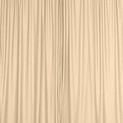 Beige fabric drapes with soft texture and elegant folds.