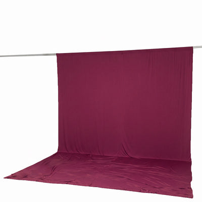 Magenta fabric backdrop on a crossbar with floor sweep, studio photography background