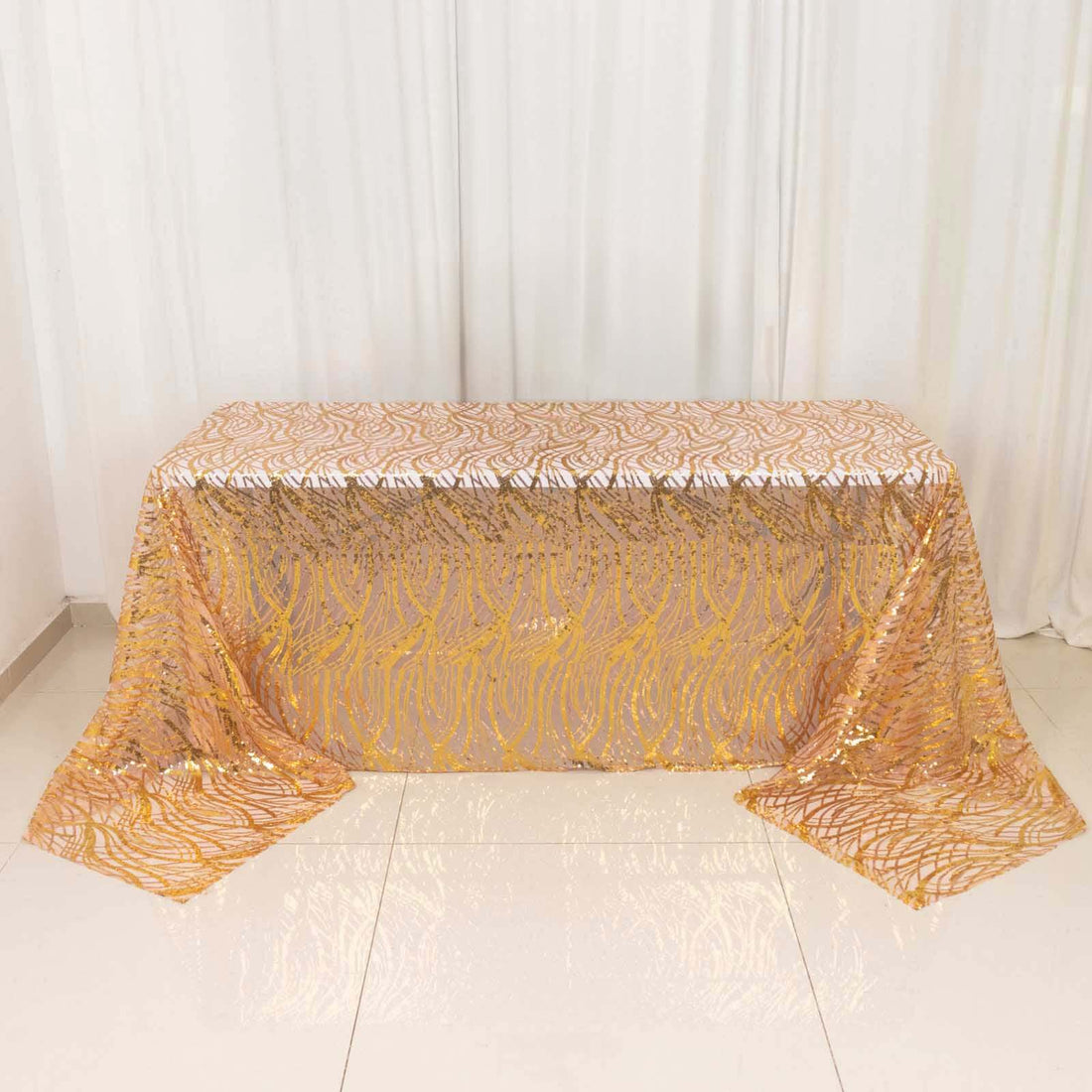 Gold sequin tablecloth draped elegantly over a table.
