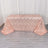 Rose gold sequin tablecloth with wavy pattern on a light wooden floor.