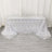 Silver sequin tablecloth with intricate leaf pattern on a table.