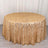 Gold patterned round tablecloth on a table.