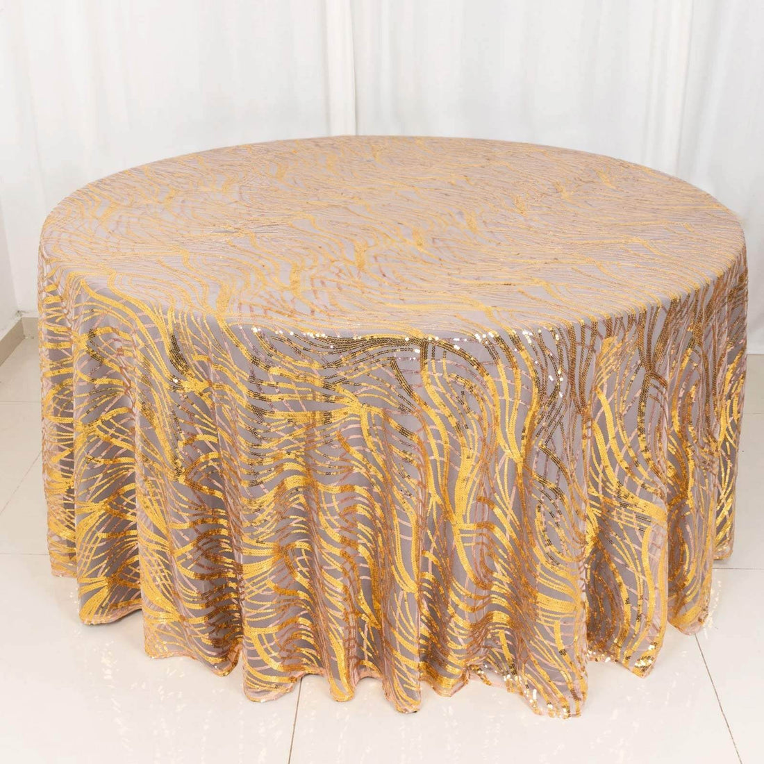 Round tablecloth with gold and purple wavy design, perfect for events and parties.