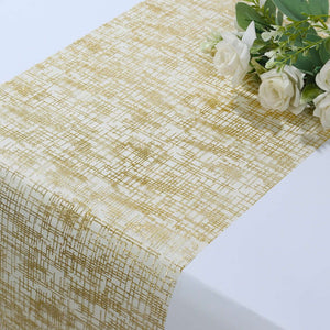 Gold patterned table runner with white roses on a plain background.