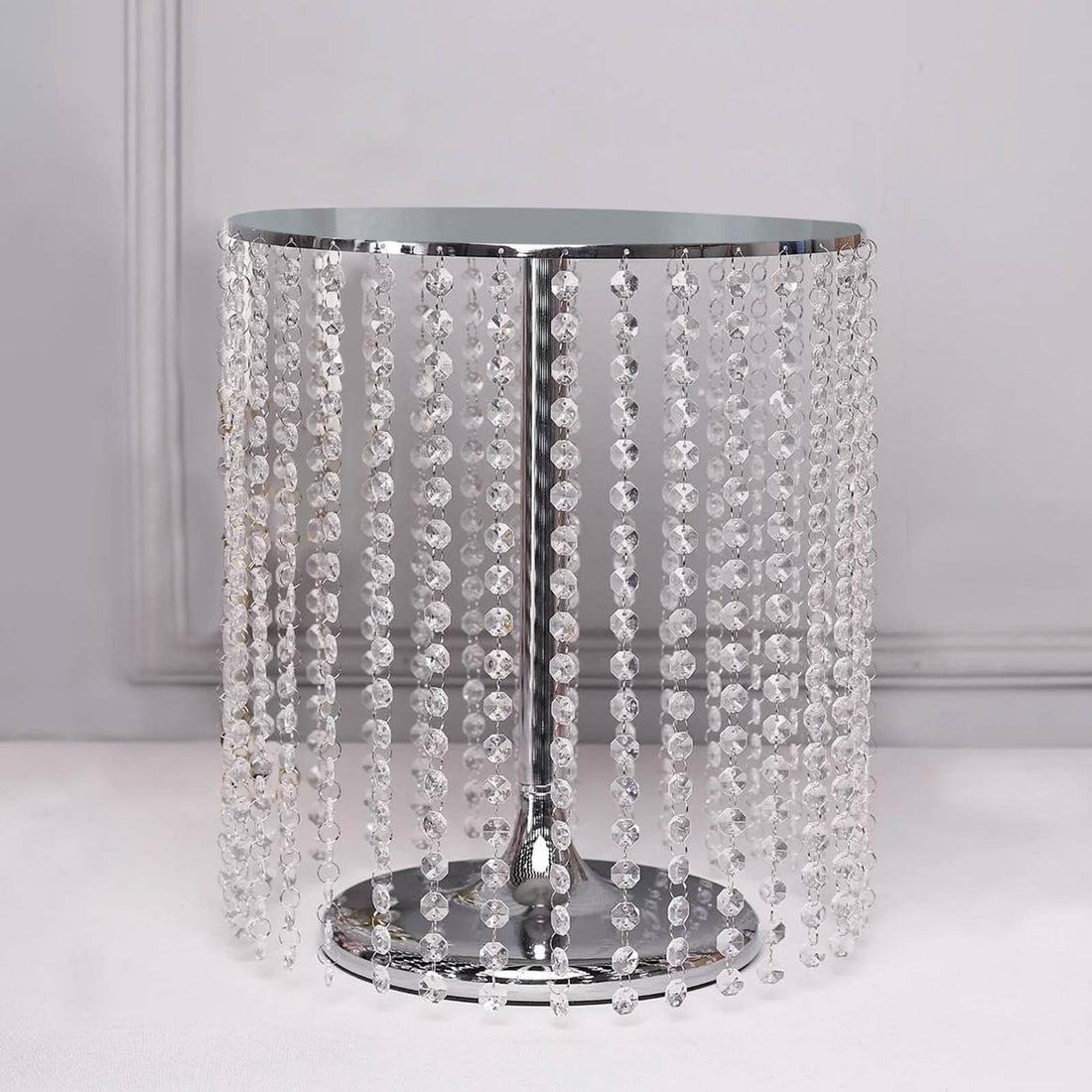Crystal beaded side table with chrome base, elegant and stylish decor.