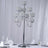 Elegant silver candelabra with crystal candle holders, perfect for formal dining.