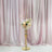 Elegant gold flower stand with a round vase holding soft pastel roses and white blooms.