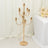 Gold candelabra with multiple candle holders on a plain backdrop.