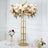 Elegant flower centerpiece on gold stand for event decor.