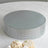 Silver mirrored cake stand with rhinestone accents.