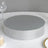 Silver cake stand with a mirrored top and textured base.