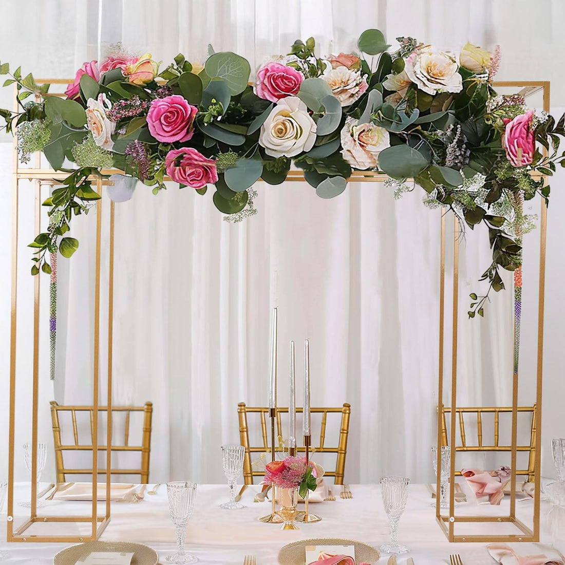 Elegant floral arch with pink and cream roses for wedding decor.