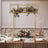 Elegant wedding table centerpiece with flowers and candles in a luxurious setting.