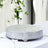 Decorative silver serving tray with intricate design on a table setting.