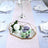 Elegant table setting with macarons and floral decor.