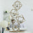 Geometric gold candle holder display with glass tealight holders