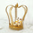Gold crown dessert stand with cupcakes and parfaits on a table.
