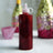 Red glitter bottle with a nozzle, perfect for crafting and decorating.