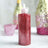 Red glitter glue bottle with a nozzle, ideal for crafting projects.