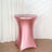 Pink stretch table cover for round tables in a studio setting.
