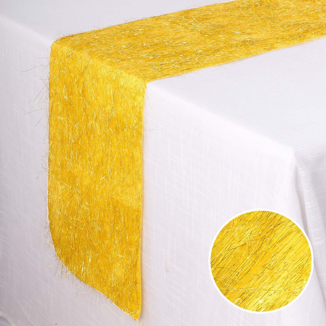 Yellow table runner on a white table, showcasing a textured design.