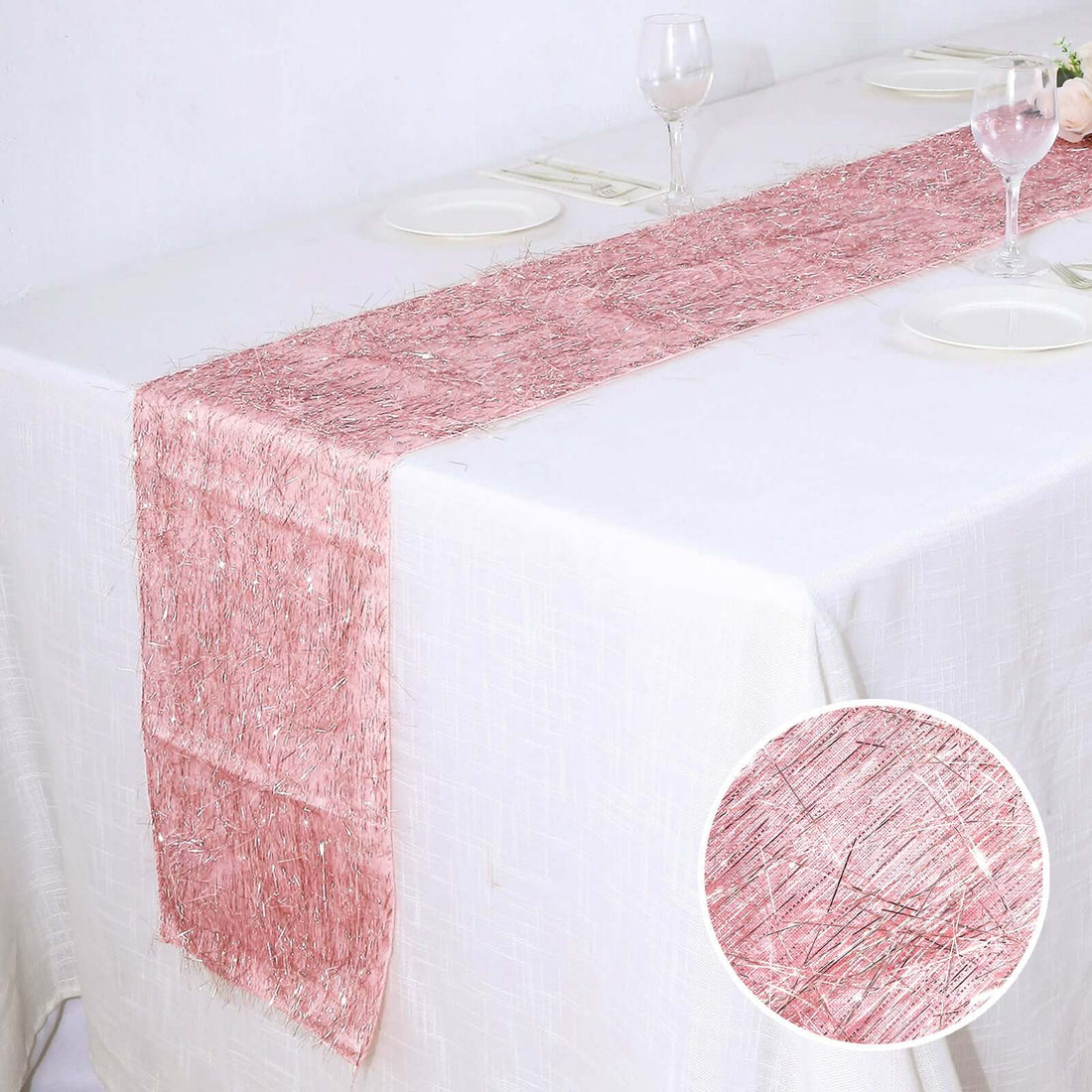 Pink table runner with delicate shimmer on a dining table.