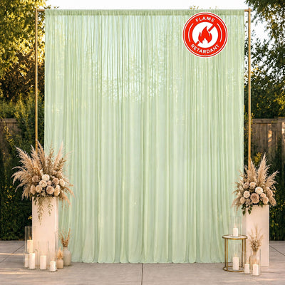 Mint green flame-retardant event backdrop curtain with floral decor and candles