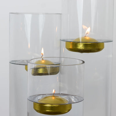 Floating candles in glass holders with gold accents