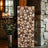 Wooden log art piece displayed in a cozy interior setting.
