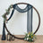 Decorative wedding arch with floral accents and draped fabric.