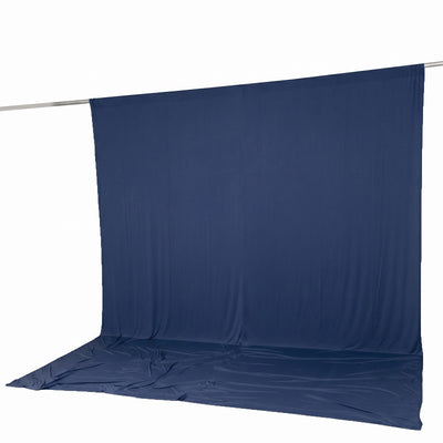 Navy blue photography backdrop curtain with floor sweep on crossbar