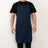 Navy blue apron with pockets, worn by a person against a plain backdrop.