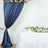 Navy blue curtain backdrop with floral table setup