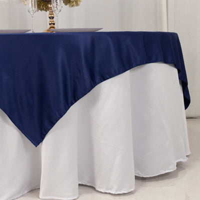 Navy satin tablecloth draped elegantly over a white table.