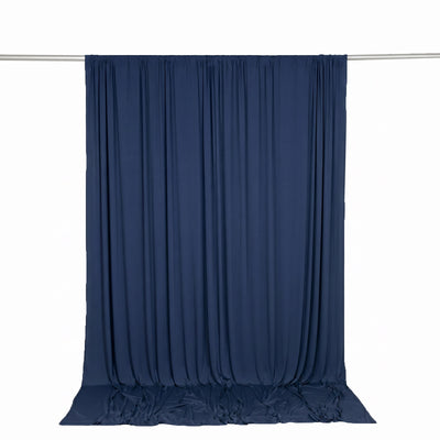 Navy blue sheer curtain hanging on a rod against a white background