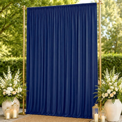 Navy blue wedding backdrop curtain with gold frame and floral lantern decor