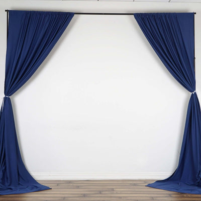 Navy blue curtain backdrop on a white wall for events or photography