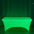 Green illuminated table cover for events and gatherings.