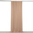 Beige fabric drapery hanging from a black rod against a plain backdrop