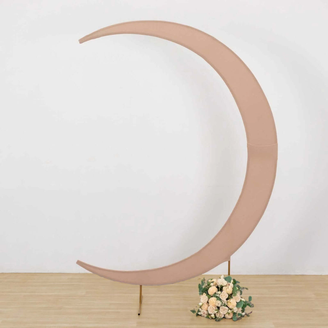 Moon-shaped decor with floral arrangement at the base