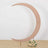 Moon-shaped decor with floral arrangement at the base