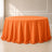 Orange polyester round tablecloth with a seamless finish.