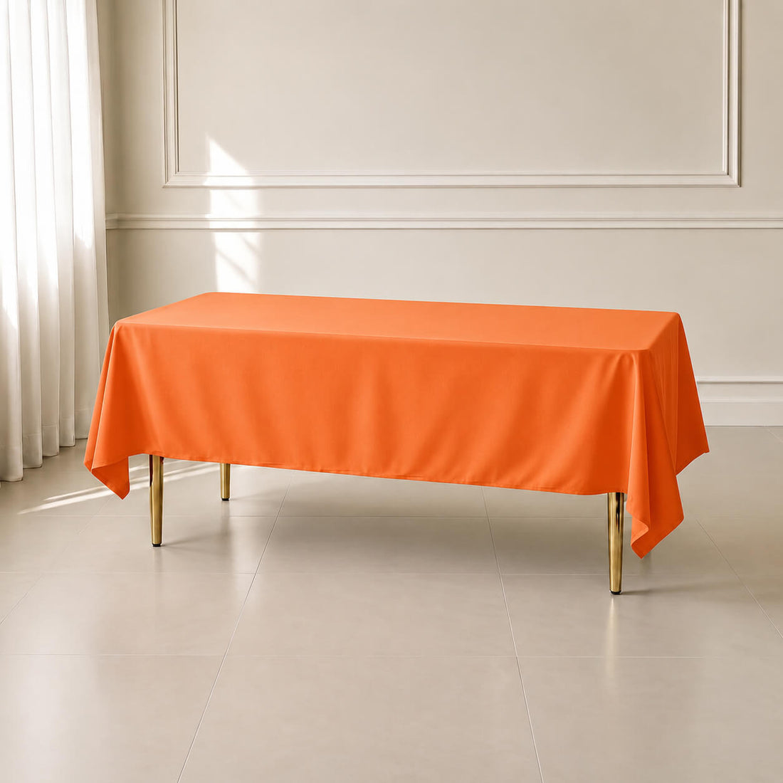 Orange wrinkle-resistant tablecloth on a rectangular table.