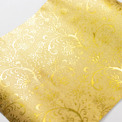 Gold decorative paper with floral design and shimmer texture. #whtbkgd