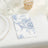 Floral napkin on a dining table setting with dessert