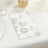 Floral patterned napkin on a textured tablecloth
