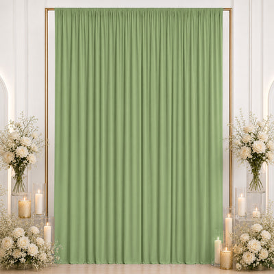 Pastel green event backdrop curtain with floral and candle decor