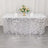 Sparkling silver sequin tablecloth with floral centerpiece and glassware