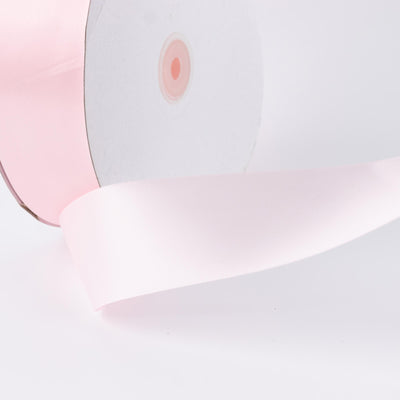 Pink and white modern table lamp with soft curved shade close-up